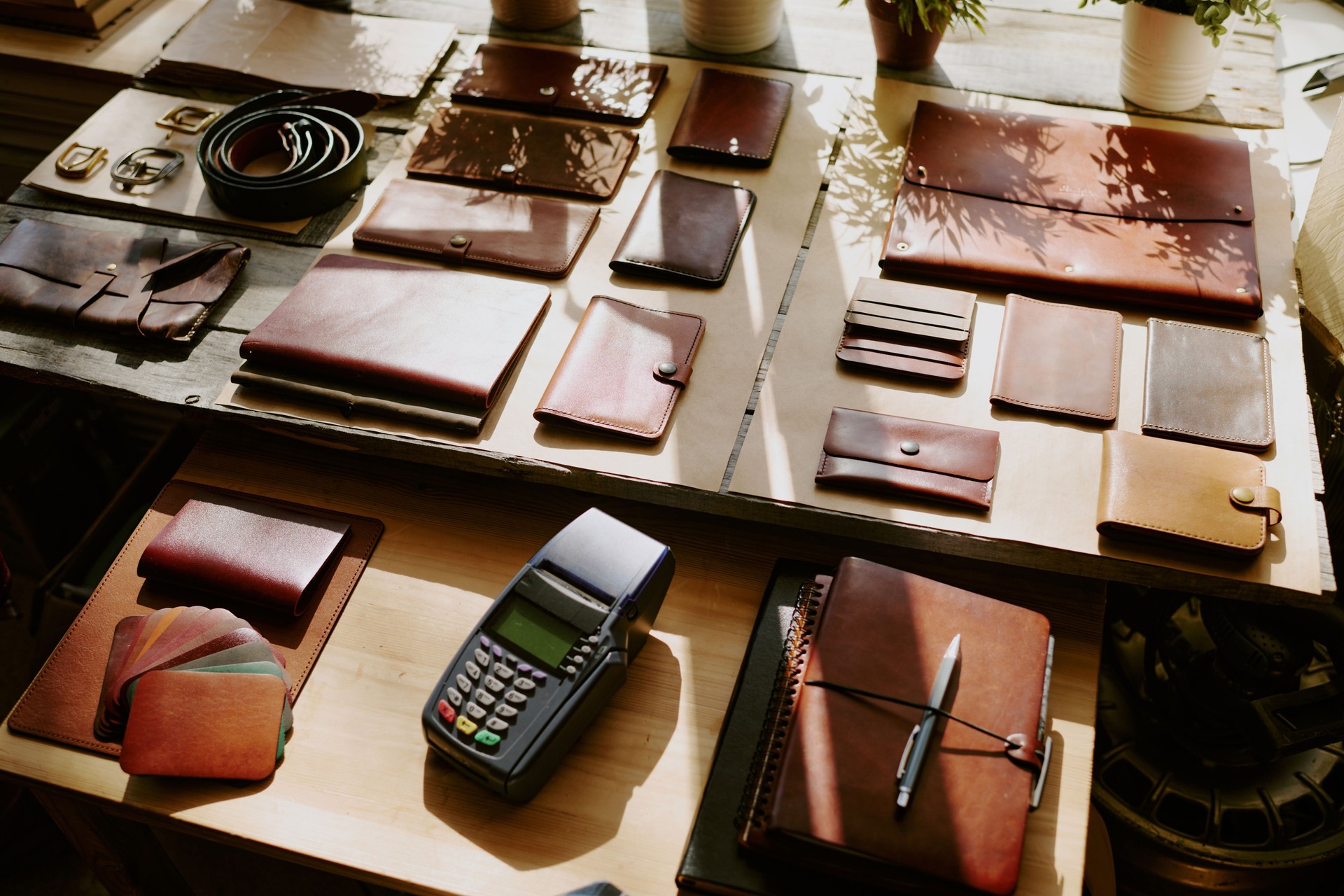 Payment Terminal Surrounded by Leather Goods